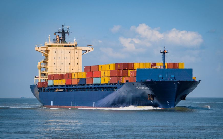 A loaded container ship under way at sea